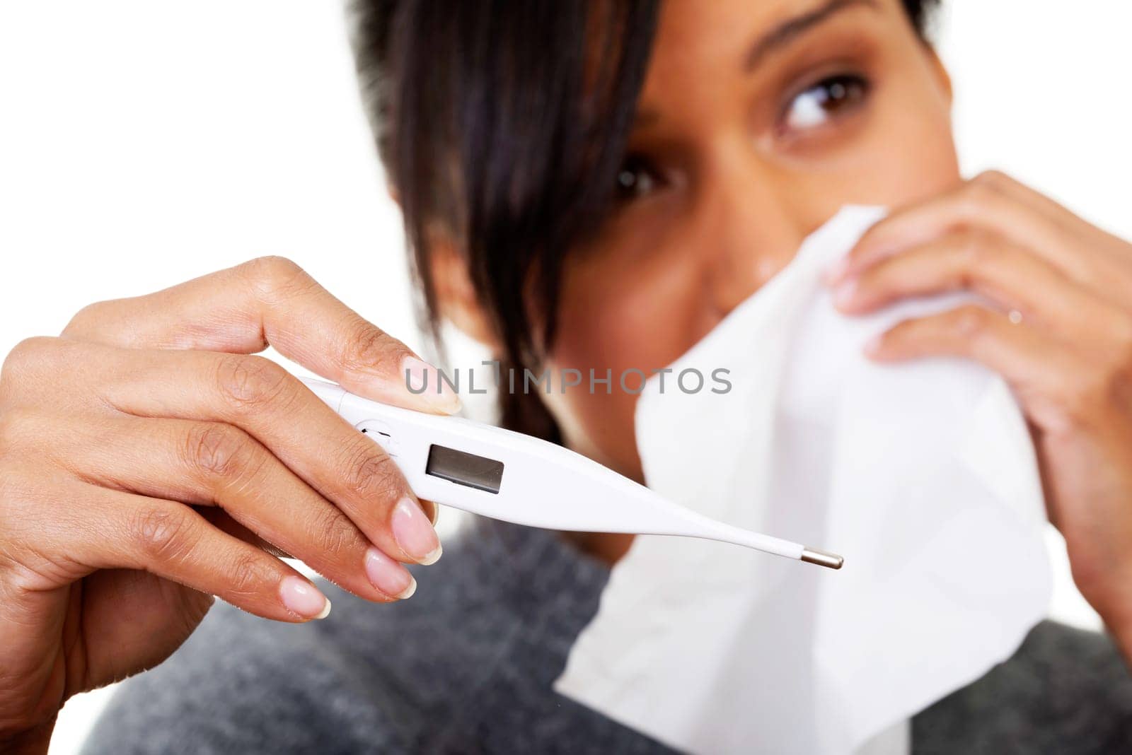 Young sick woman checking her temperature , isolated