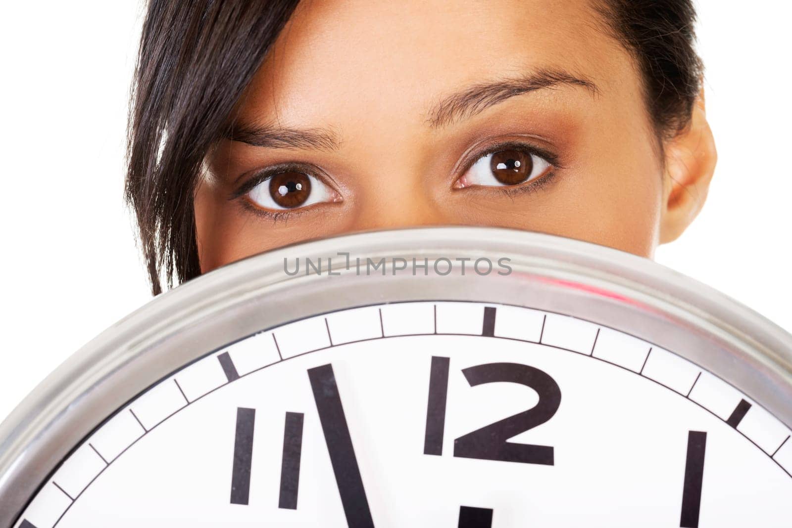 Portrait of shocked woman with clock over white background