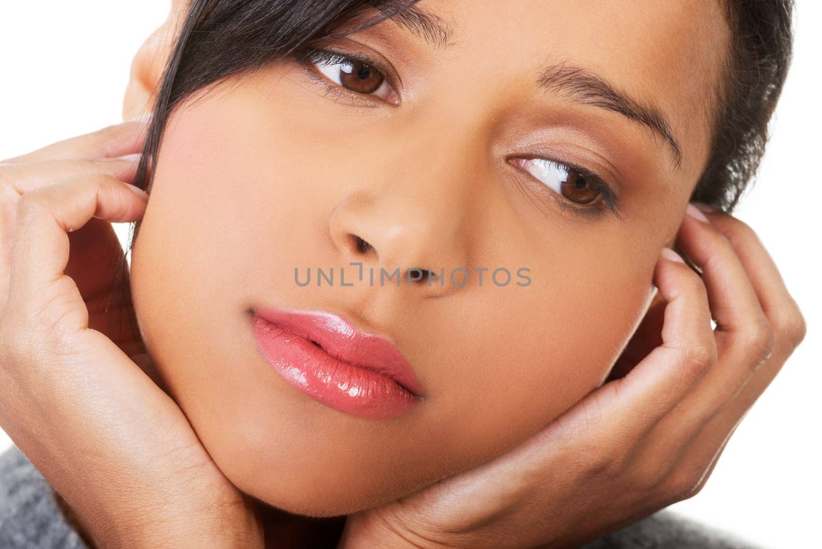 Young beautiful woman in depression. Isolated on white background.