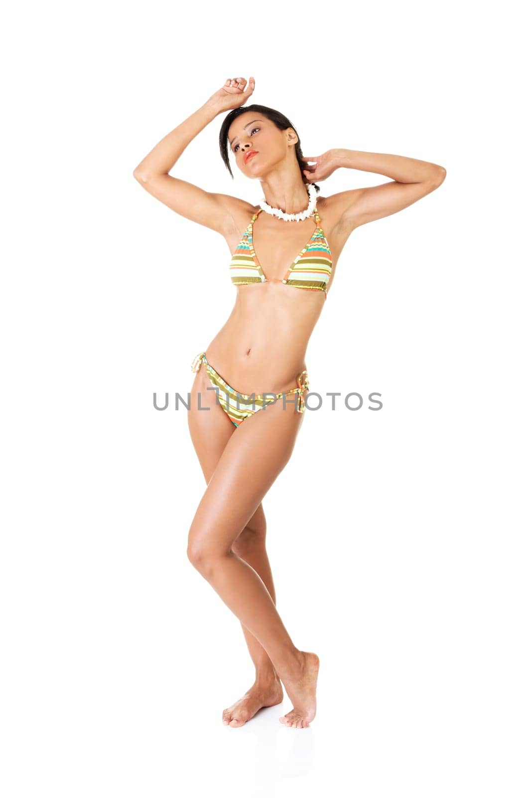 Portrait of dark skinned girl in bikini, isolated on white