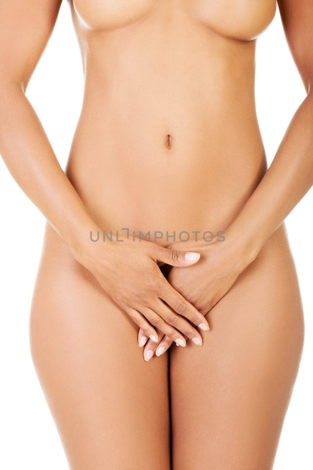 Close up of perfect nude body of young fit woman, isolated on white