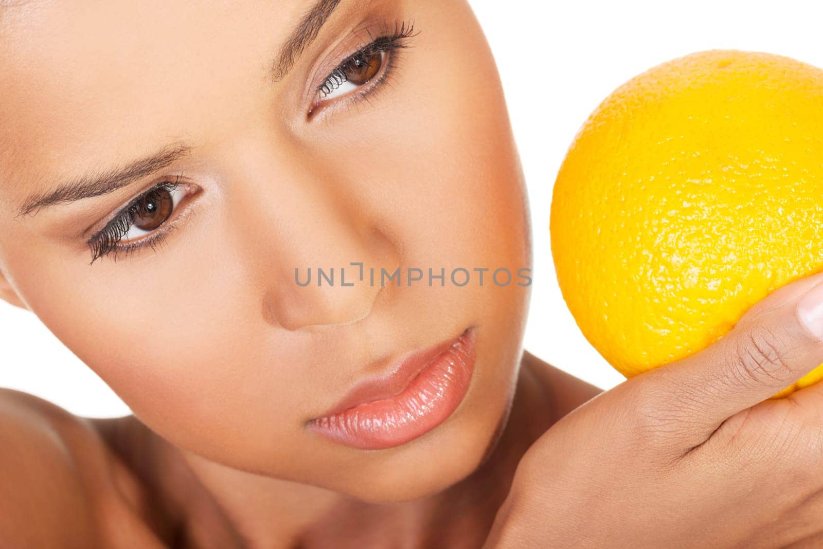 Young beautiful spa woman with orange in her hand, isolated on white