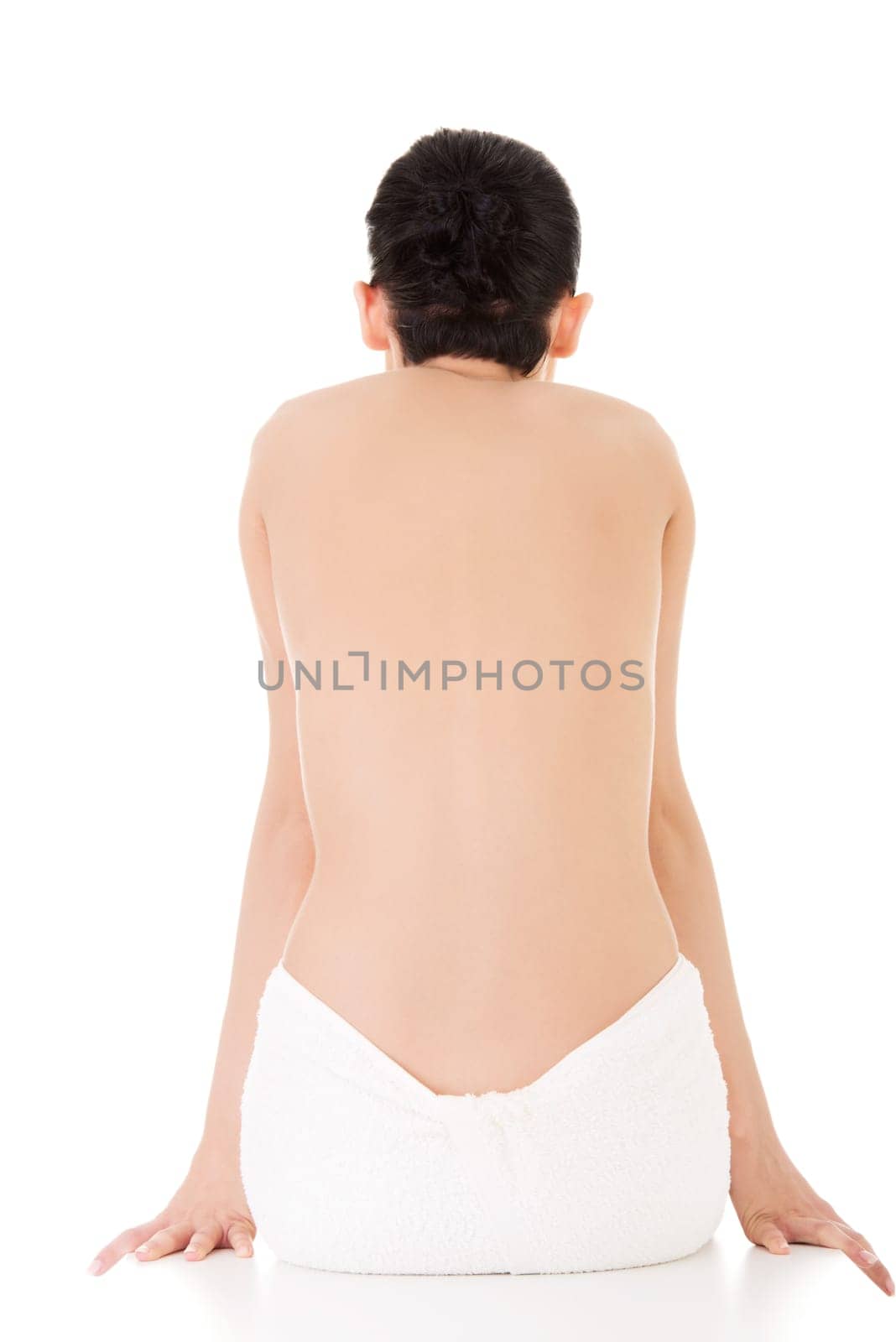 Young beautiful nude woman with towel , isolated on white