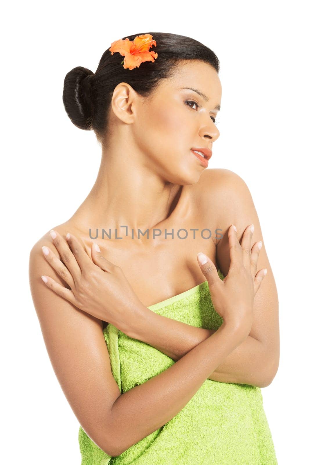 Portrait of beautiful young exotic woman with health skin and with flower