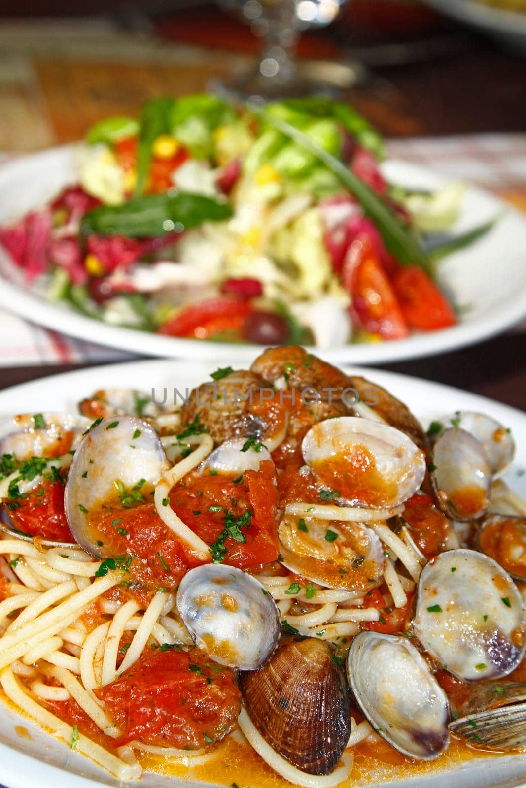 Close view of a tasty and typical spaghetti with clams dish from Italian cuisine.