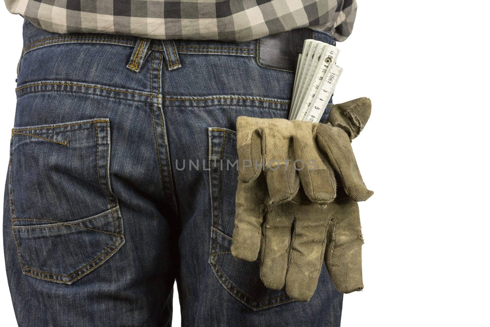 Ruler and work gloves in a trouser pocket