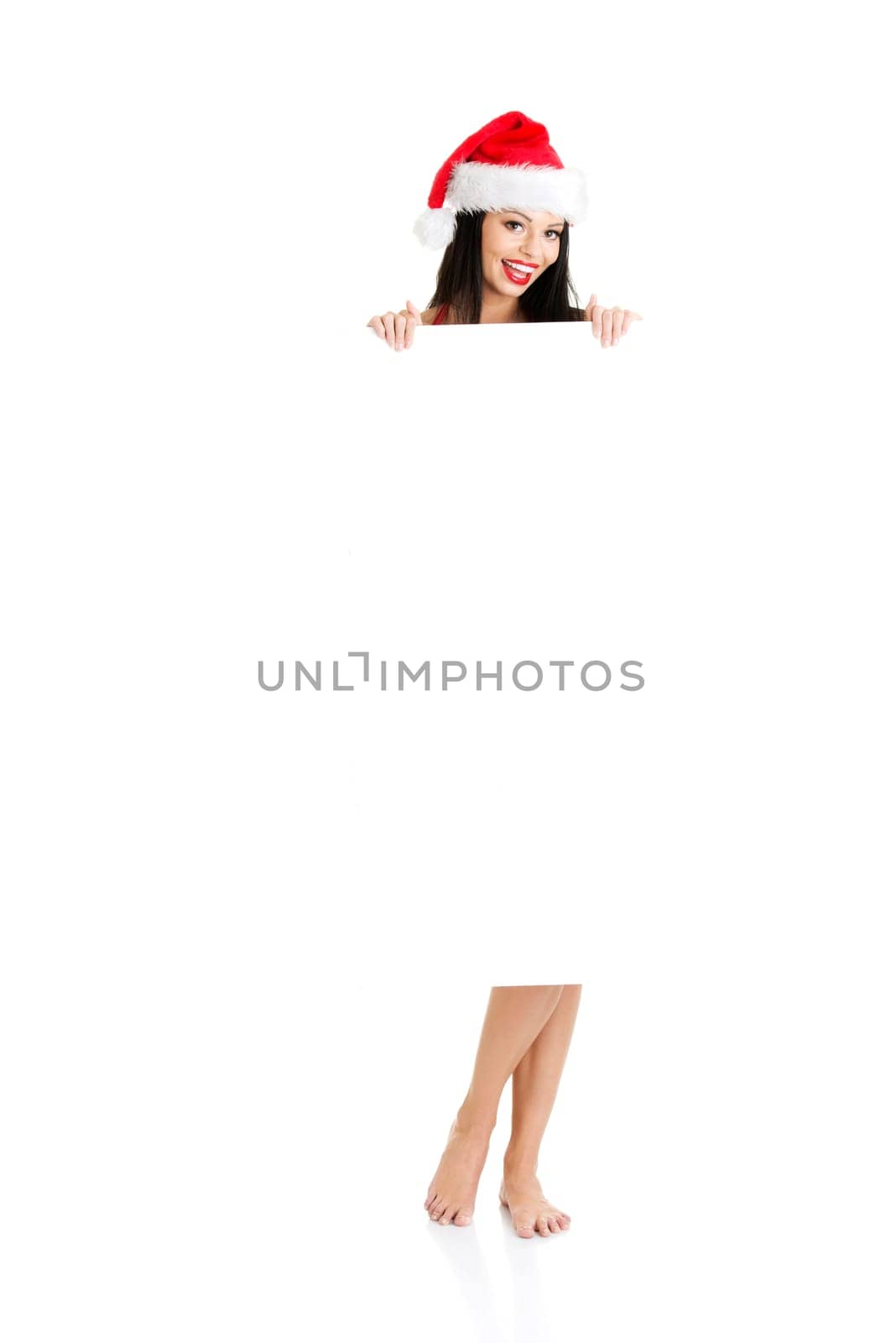 Sexy santa girl holding blank board, isolated on white