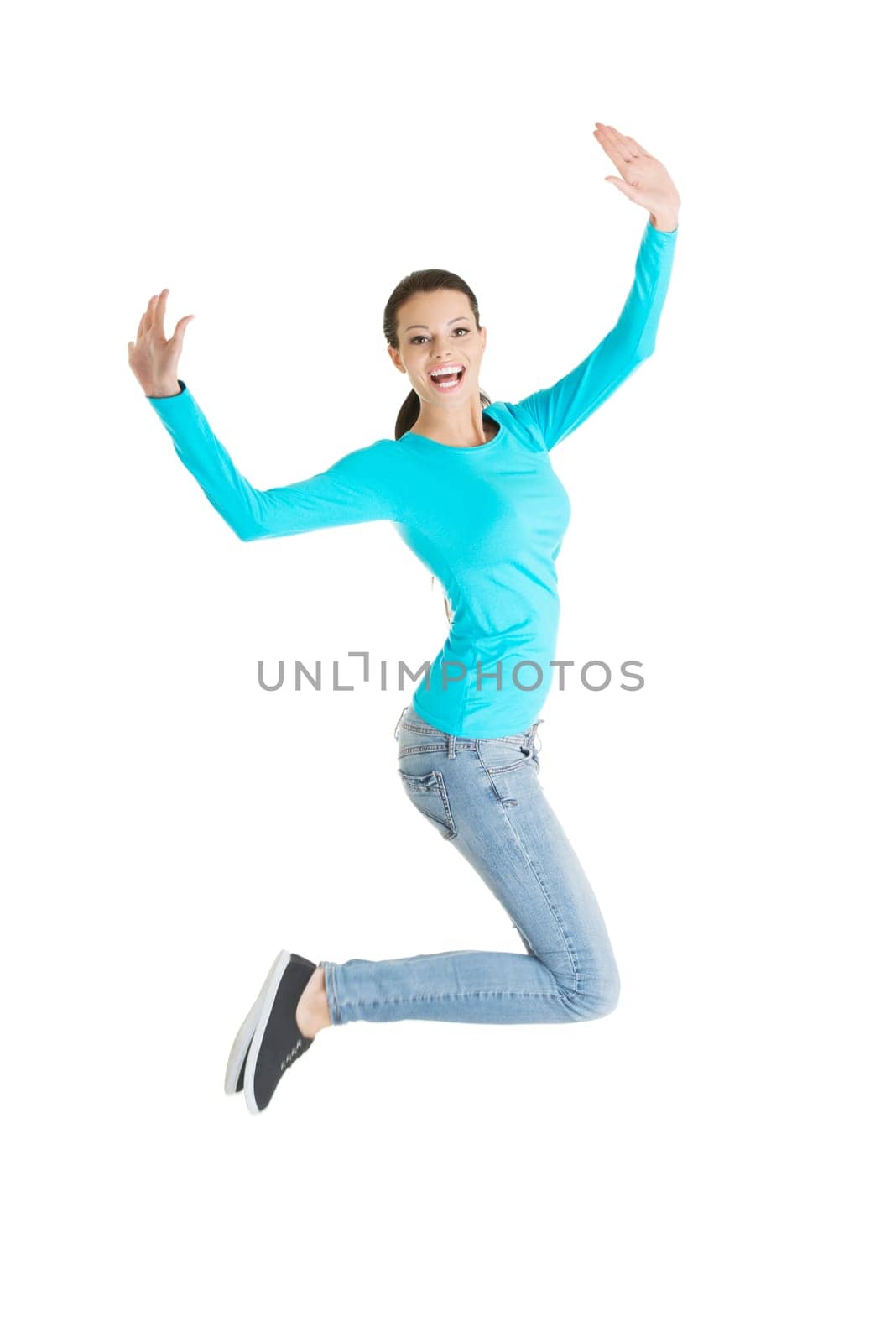 Jumping happy young woman, isolated on white background