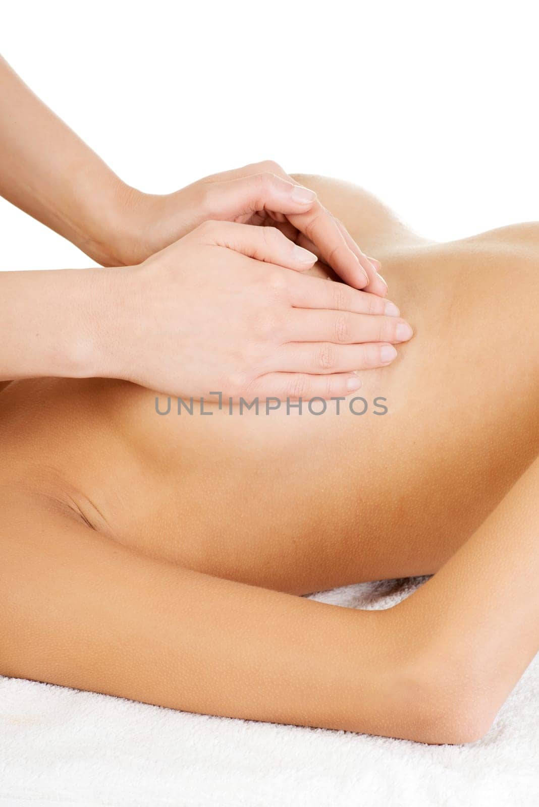 Young woman relaxing in spa. Breast massage.