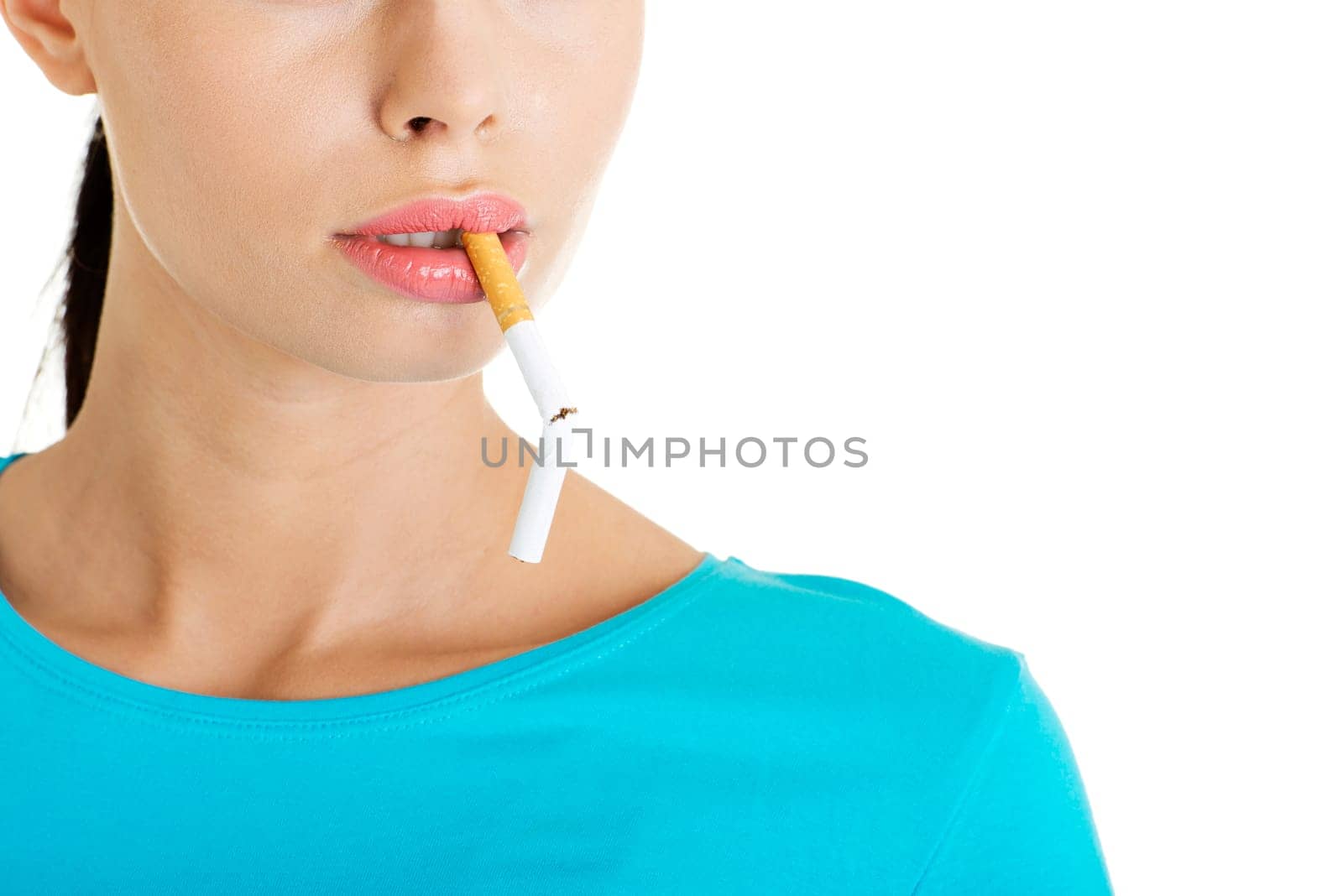 Young woman with broken cigarette. Stop smoking concept.