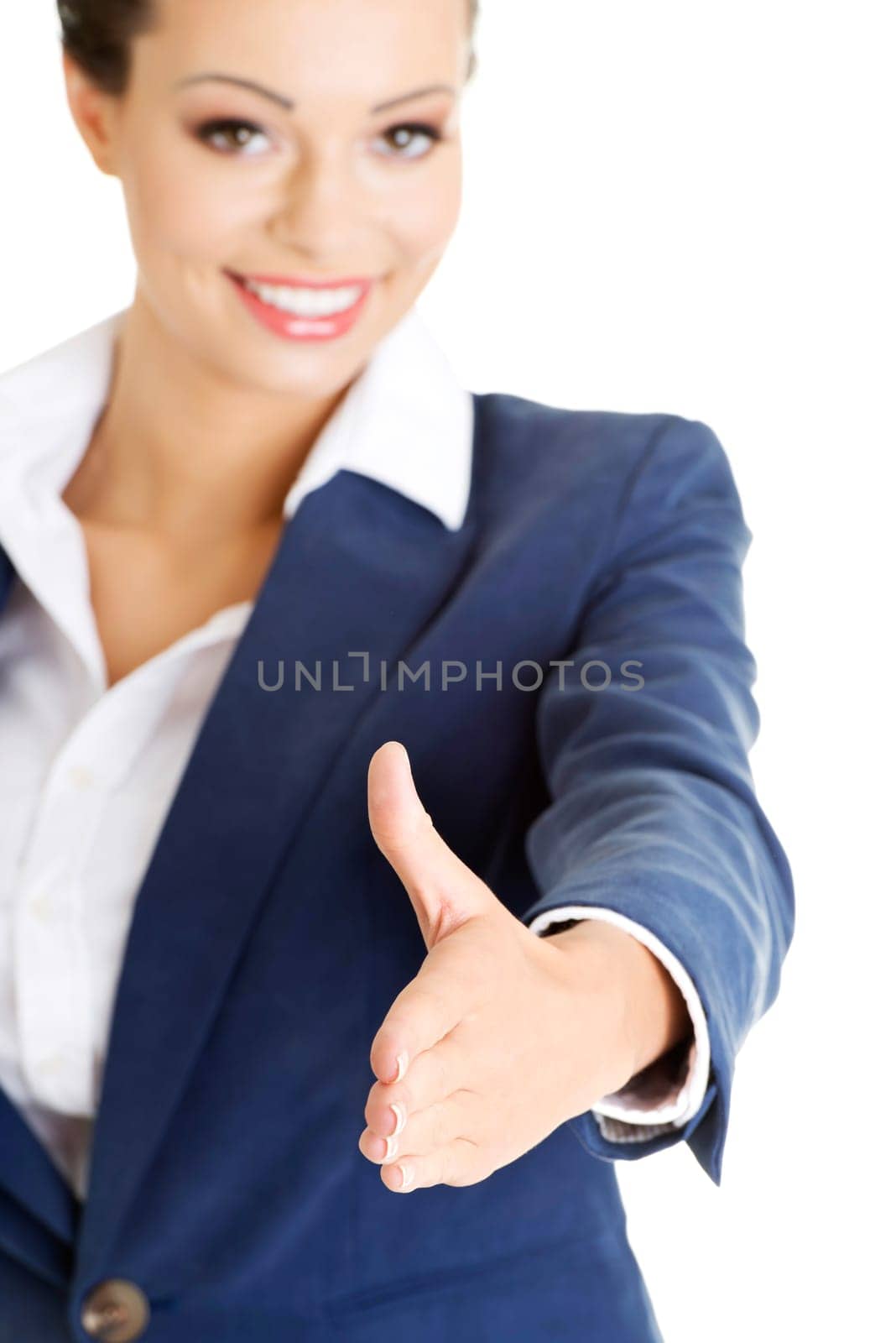 A beautiful businesswoman about to shake hands. Isolated on white