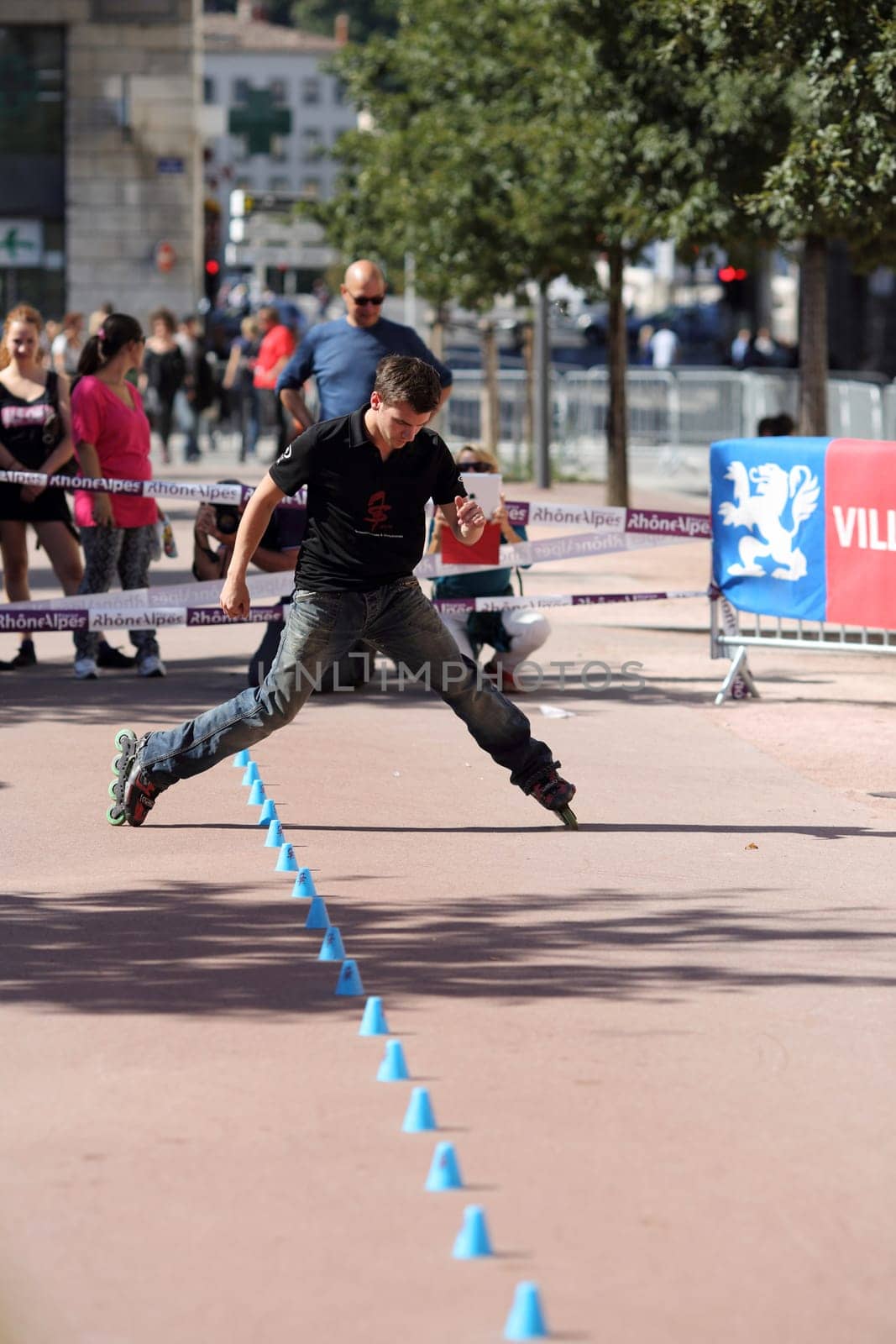 Lyon, France. September 22, 2013. Detail of a cession of exhibition of freestyle slalom in roller inline..