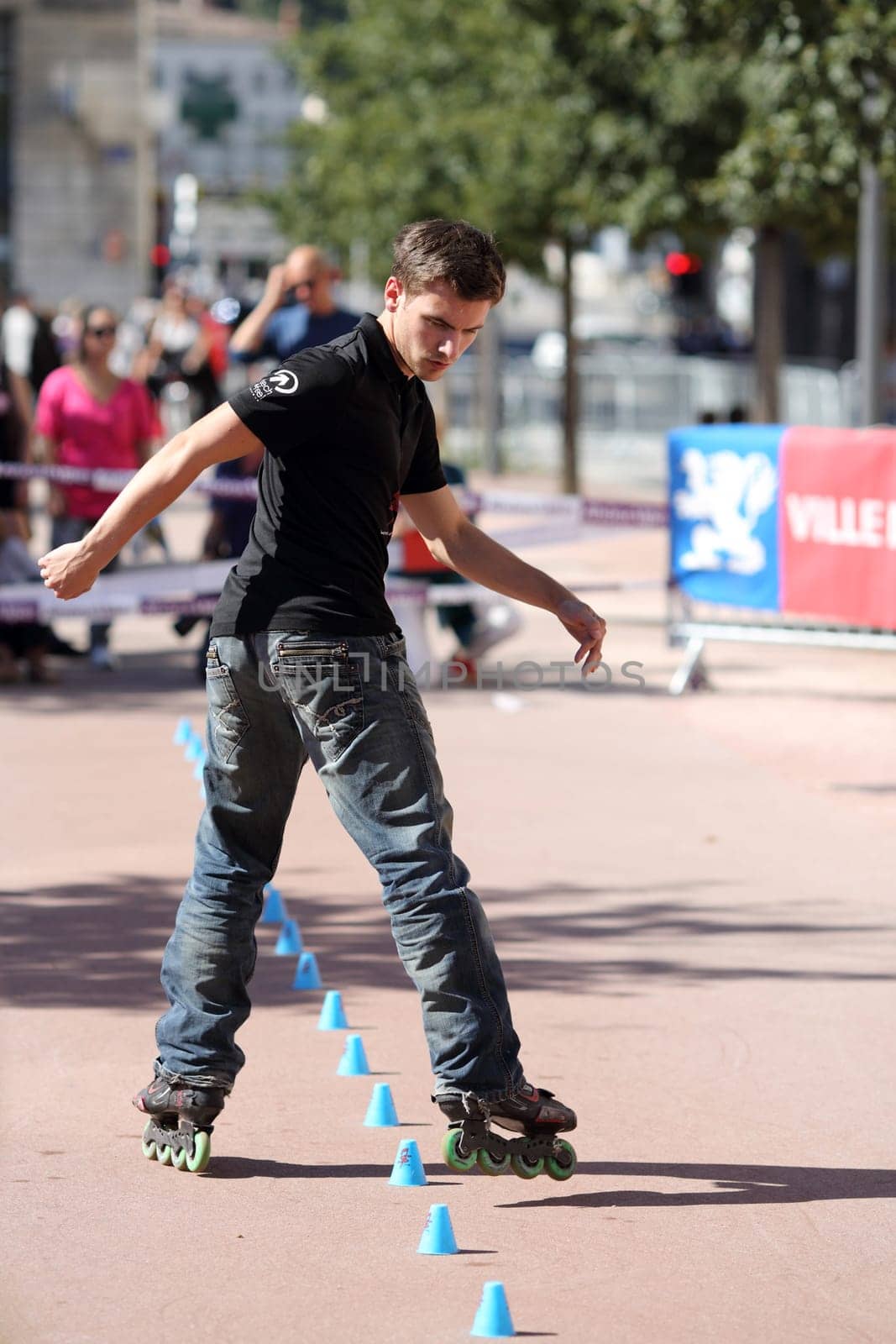 Lyon, France. September 22, 2013. Detail of a cession of exhibition of freestyle slalom in roller inline..