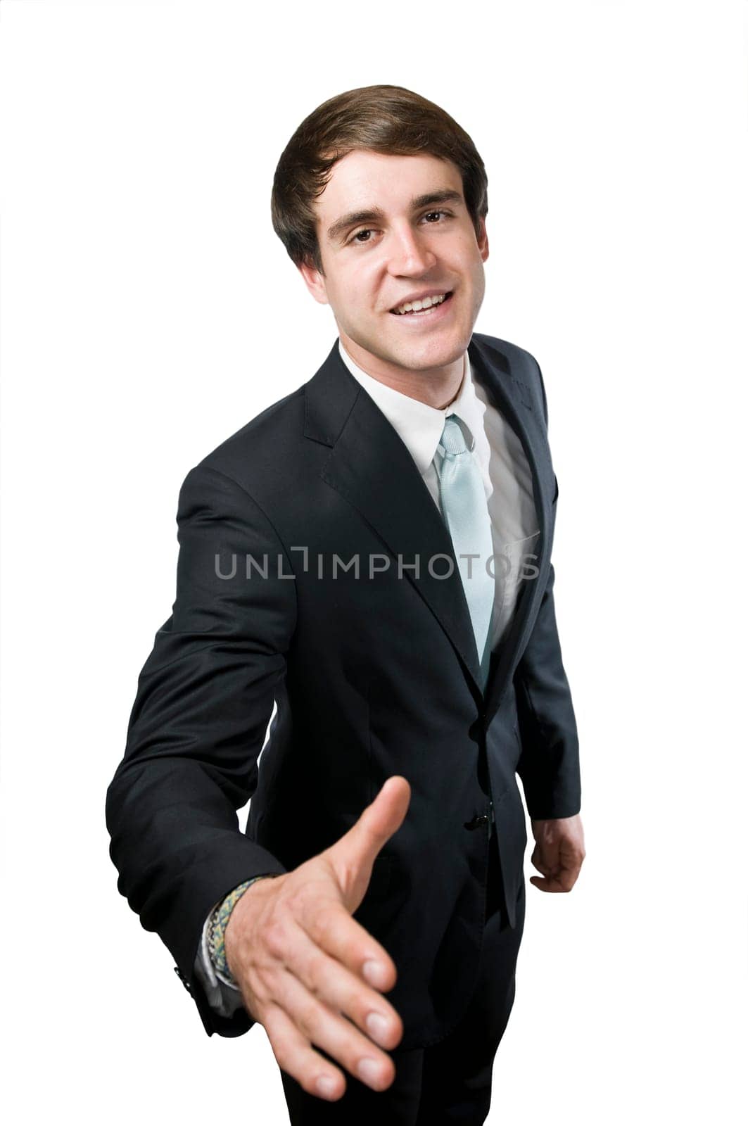 Upper body shot of a young manager with his hand extended to the camera smiling into the camera to greet him,in front of a white background