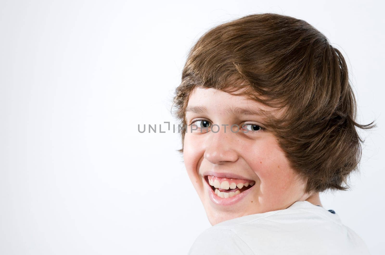 Head-and-shoulders portrait of a male teenager against a white background