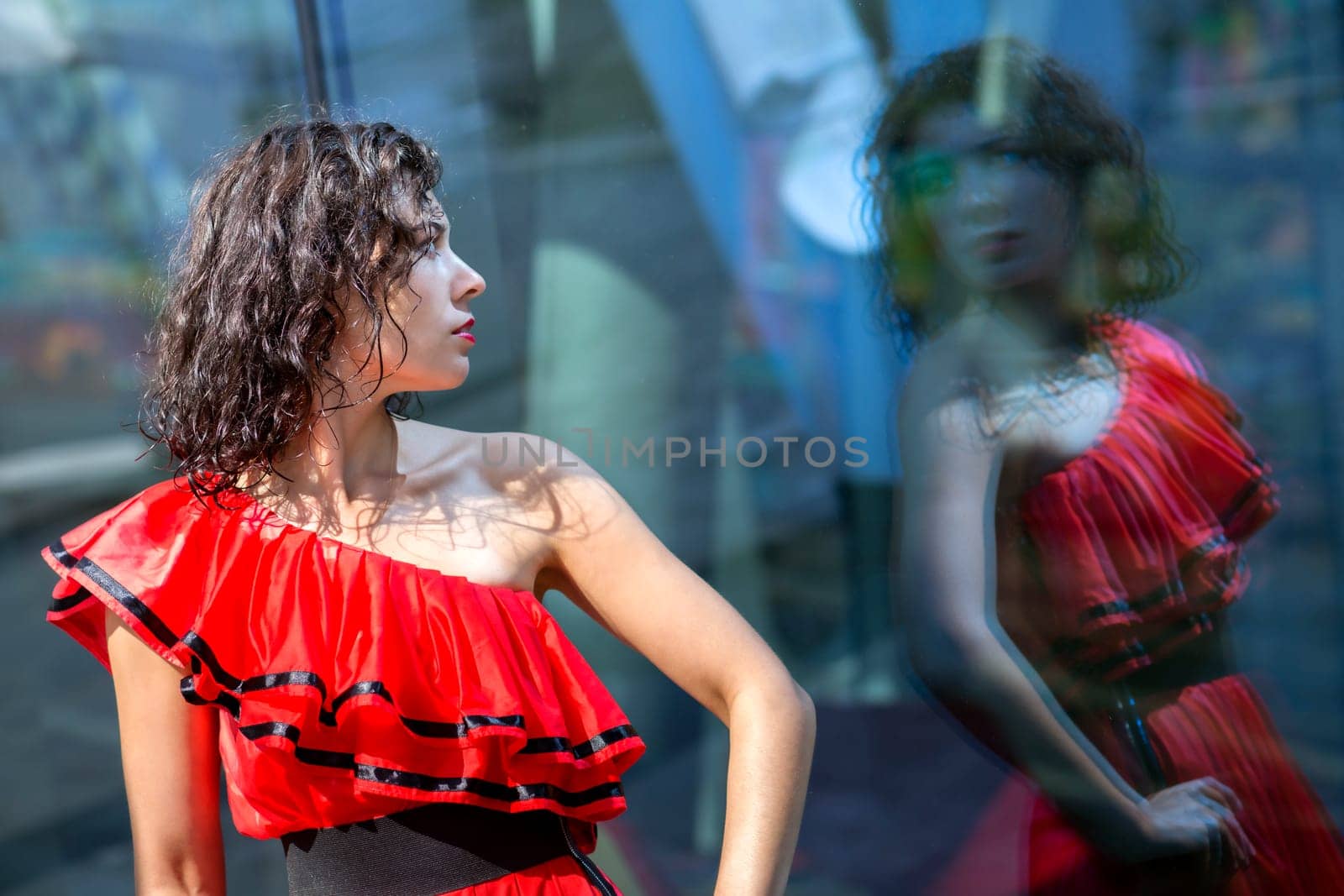 Woman in soaking wet dress marvel before reflection