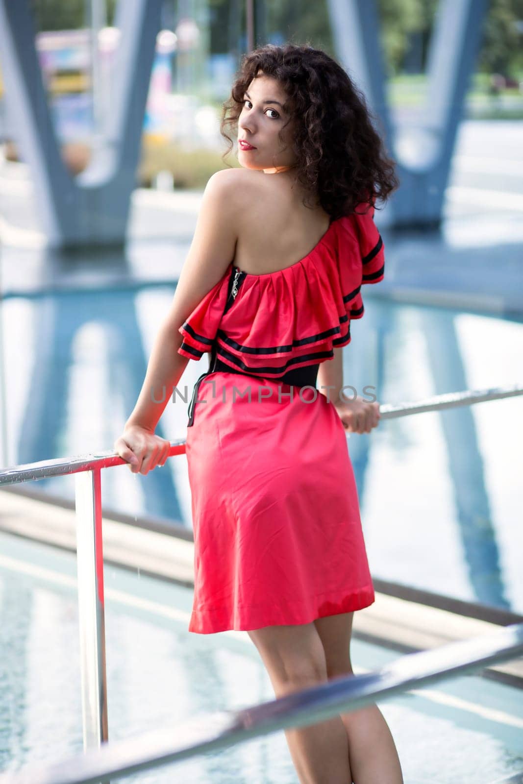 Woman in nice dress rely on street boundaries