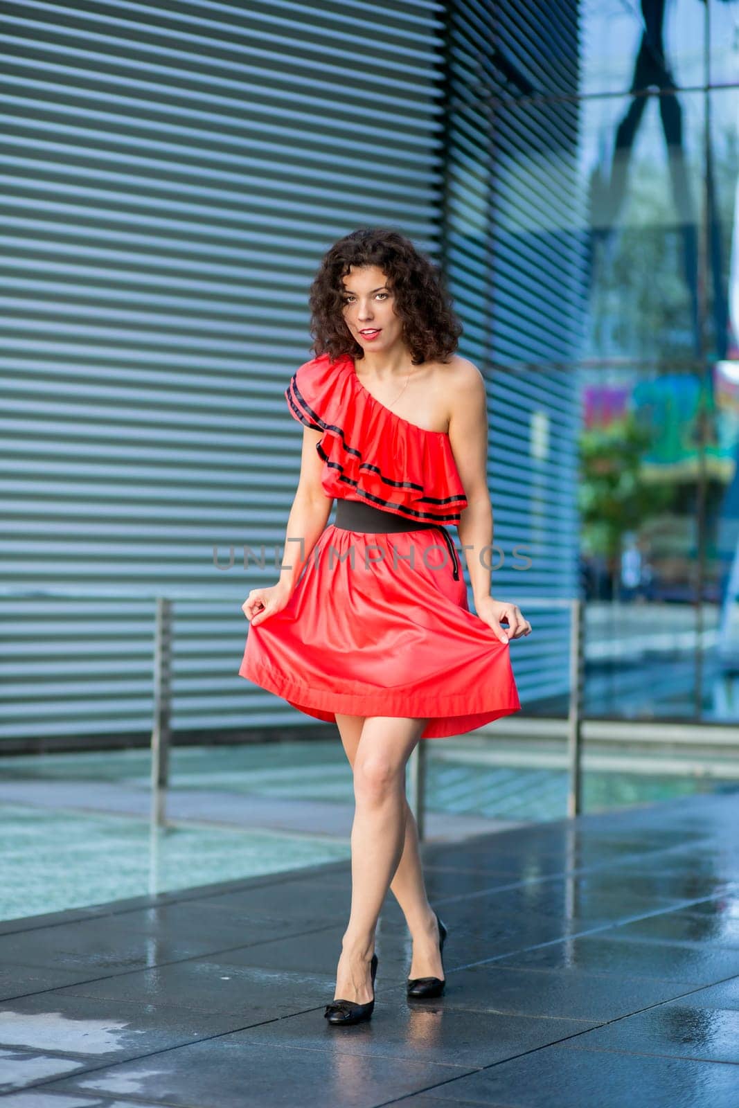 Woman in wet red dress at drying square