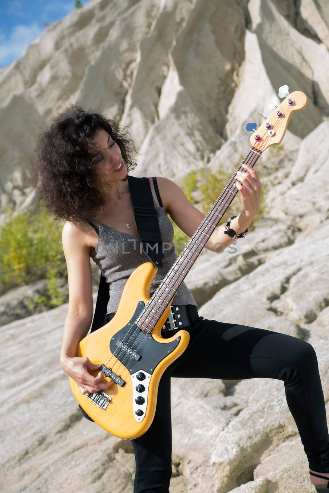 Zoomed view of woman with guitar on background