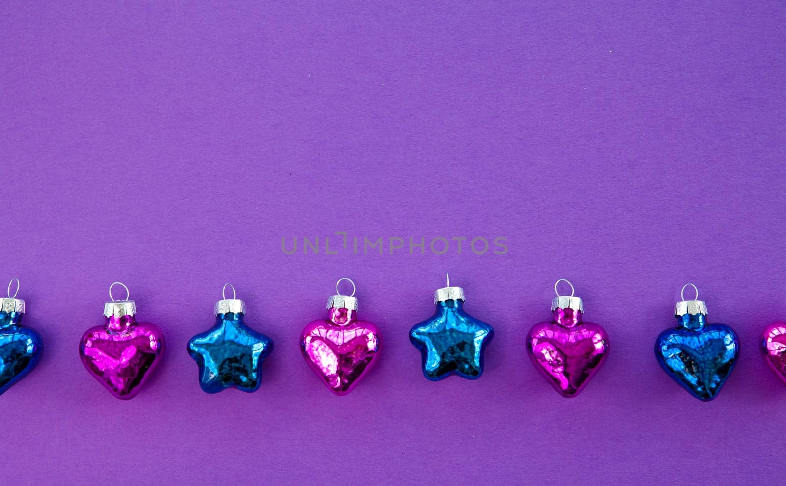 Purple background for Christmas with colorful hearts