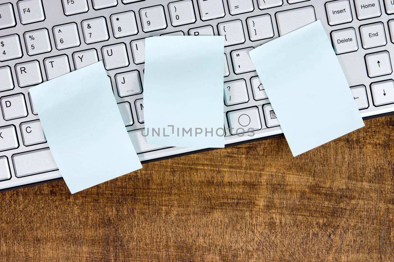 Memo on silver computer keyboard. Can be used for your text