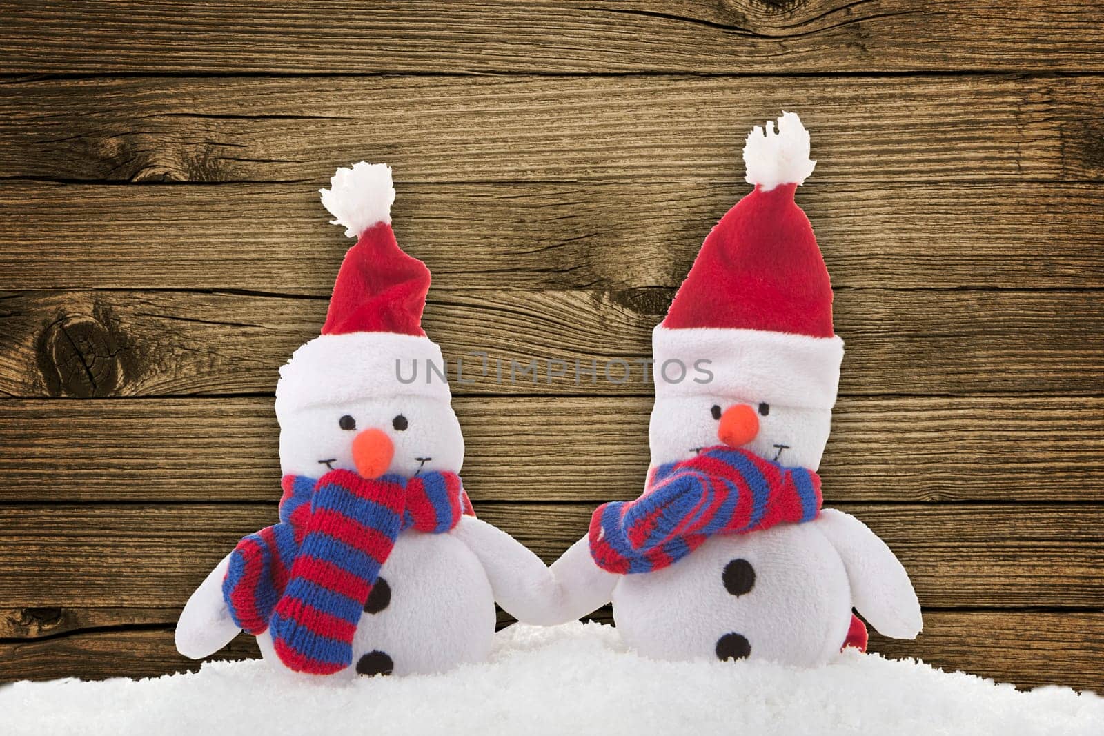 Snowmen with wooden background