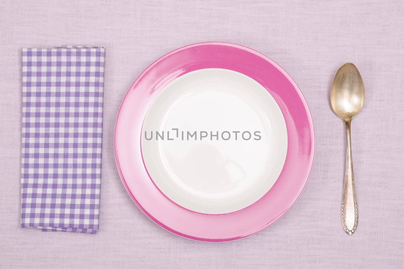 Plate with spoon and napkin with purple checks