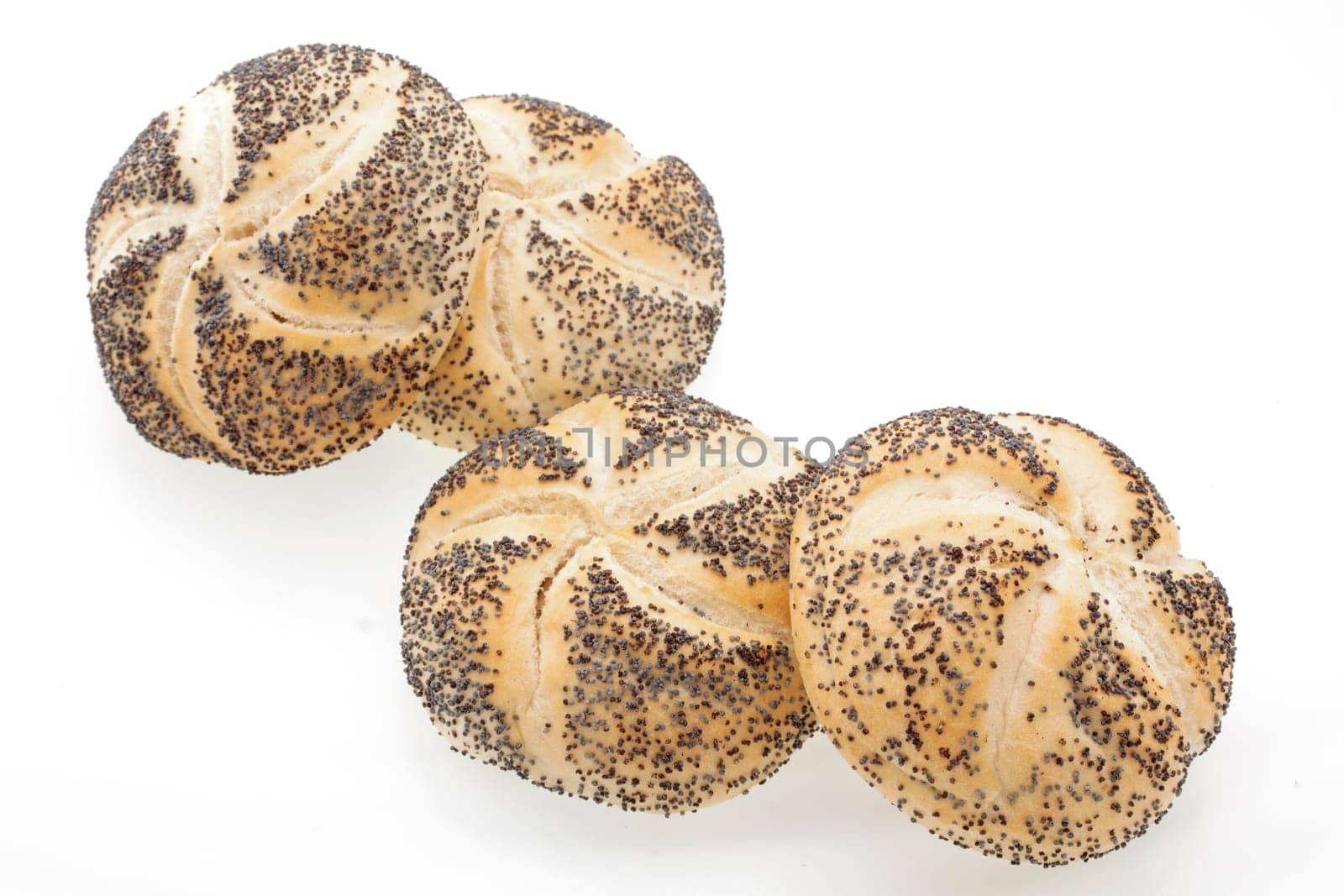 Close up of poppyseed bread rolls on a white background