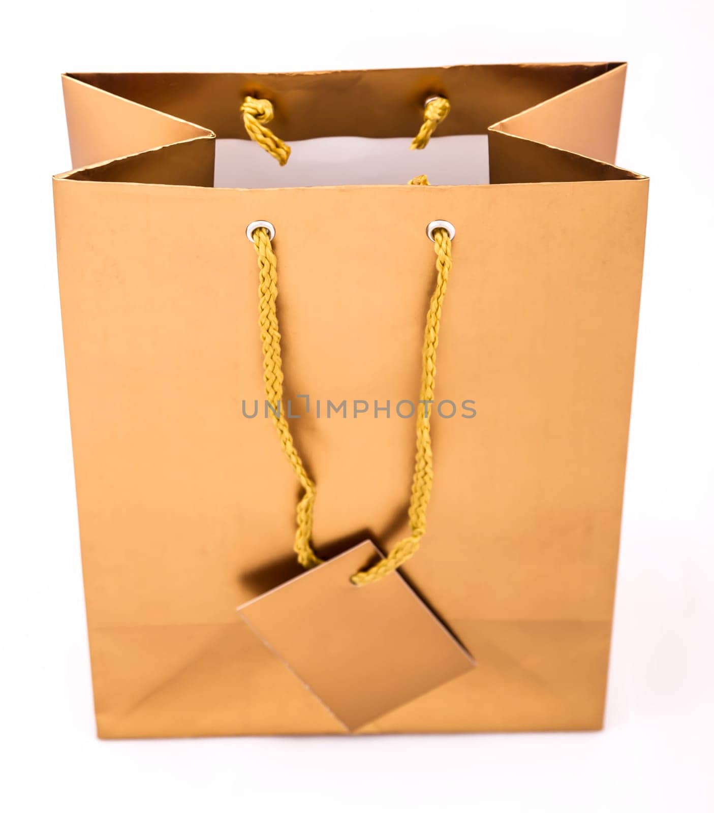 A gold gift bag isolated.