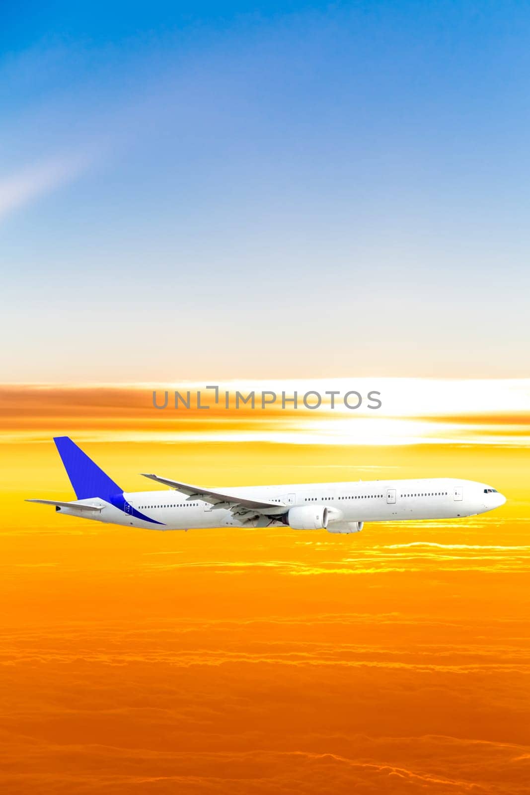 Airplane in the sky at sunset. A passenger plane in the sky
