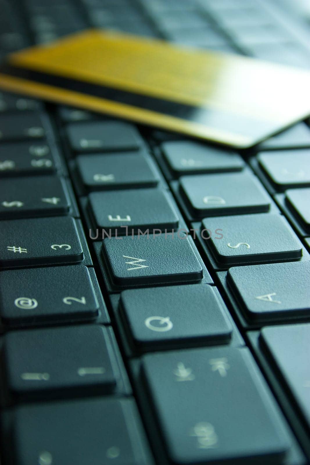 Credit card on computer keyboard