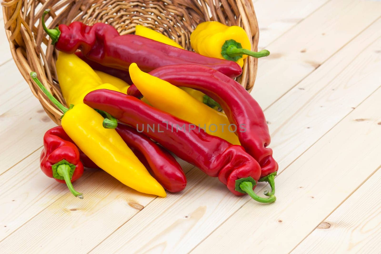 red and yellow peppers in a basket