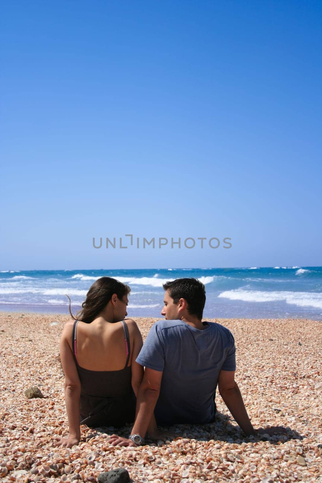 Couple sitting on the beach