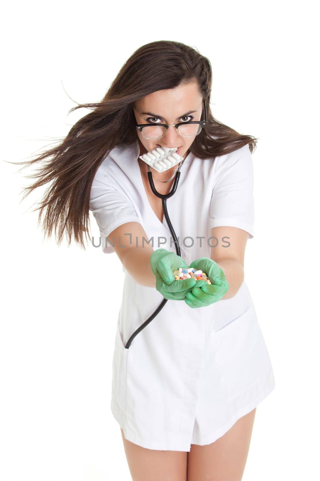 woman doctor with pills in hand. Female doctor holding many pills in her hands