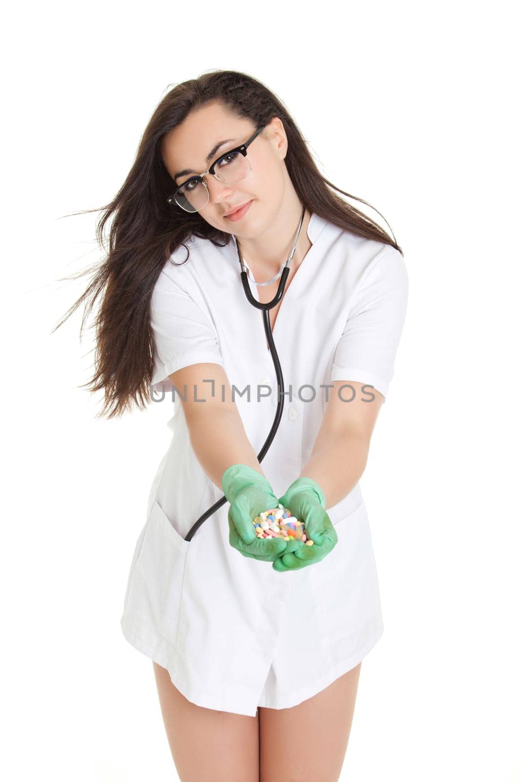 woman doctor with pills in hand. Female doctor holding many pills in her hands