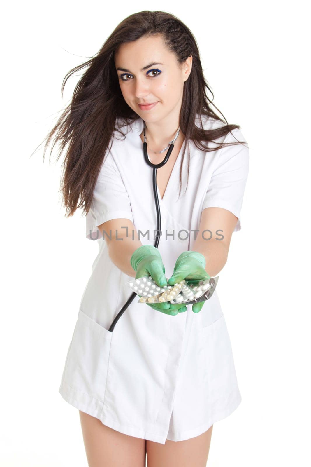 woman doctor with pills in hand. Female doctor holding many pills in her hands