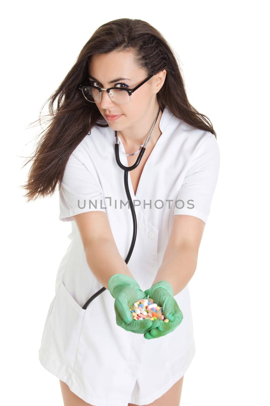 woman doctor with pills in hand. Female doctor holding many pills in her hands