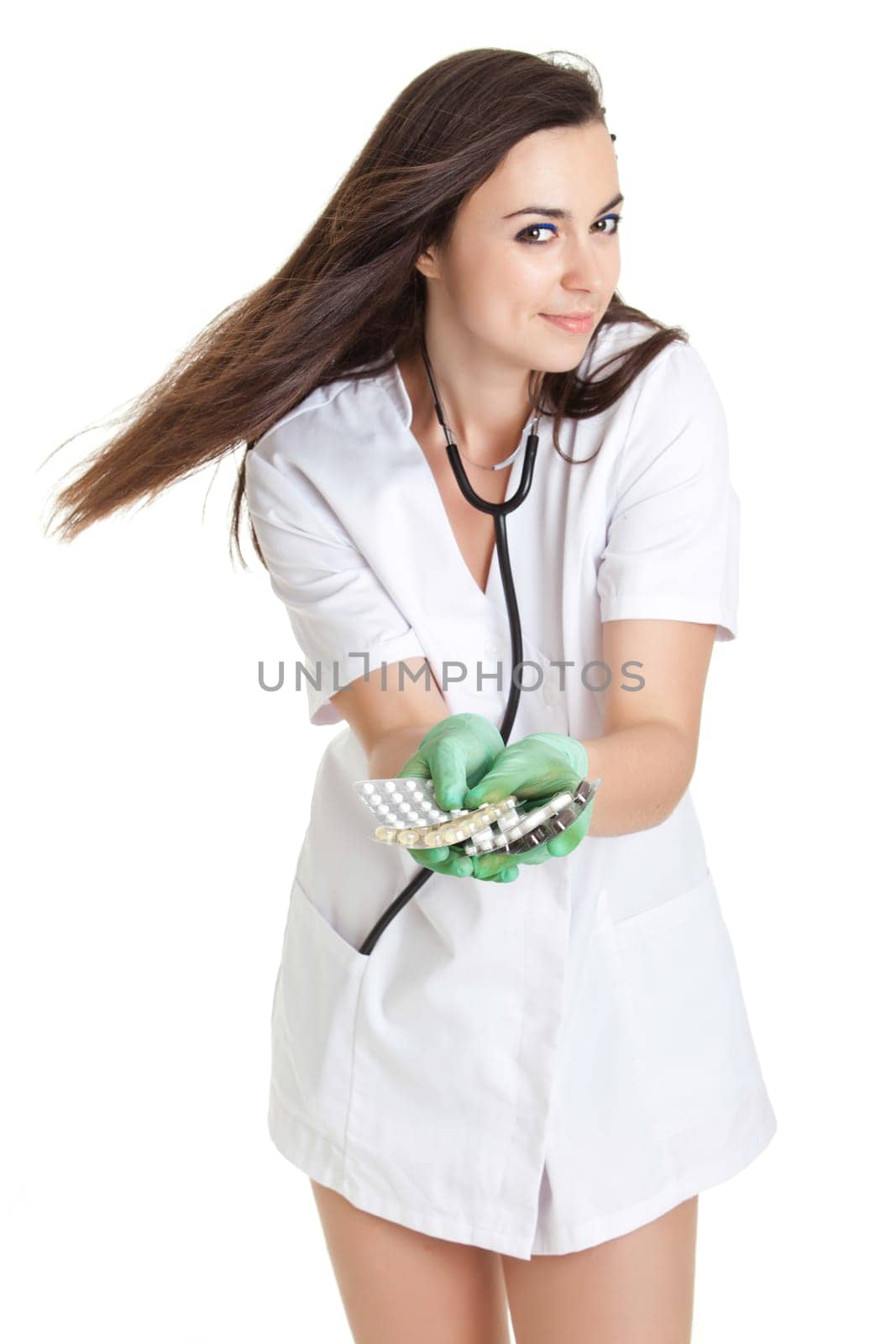 woman doctor with pills in hand. Female doctor holding many pills in her hands