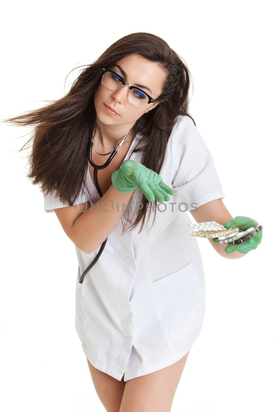 woman doctor with pills in hand. Female doctor holding many pills in her hands