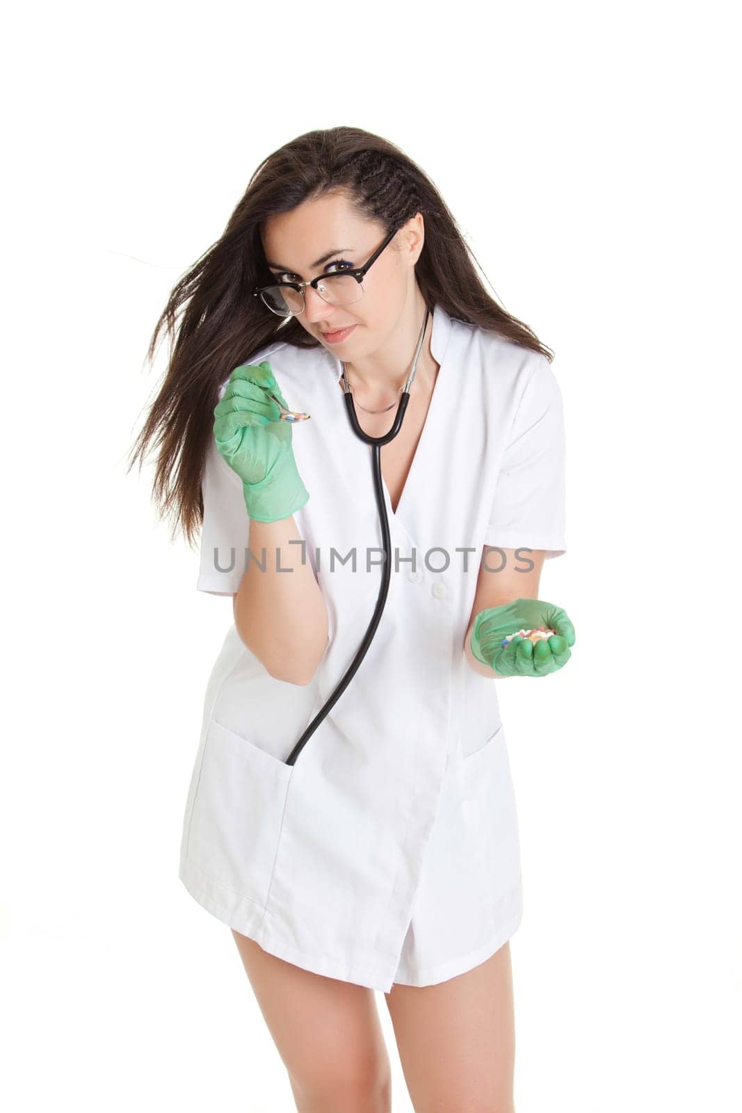 woman doctor with pills in hand. Female doctor holding many pills in her hands