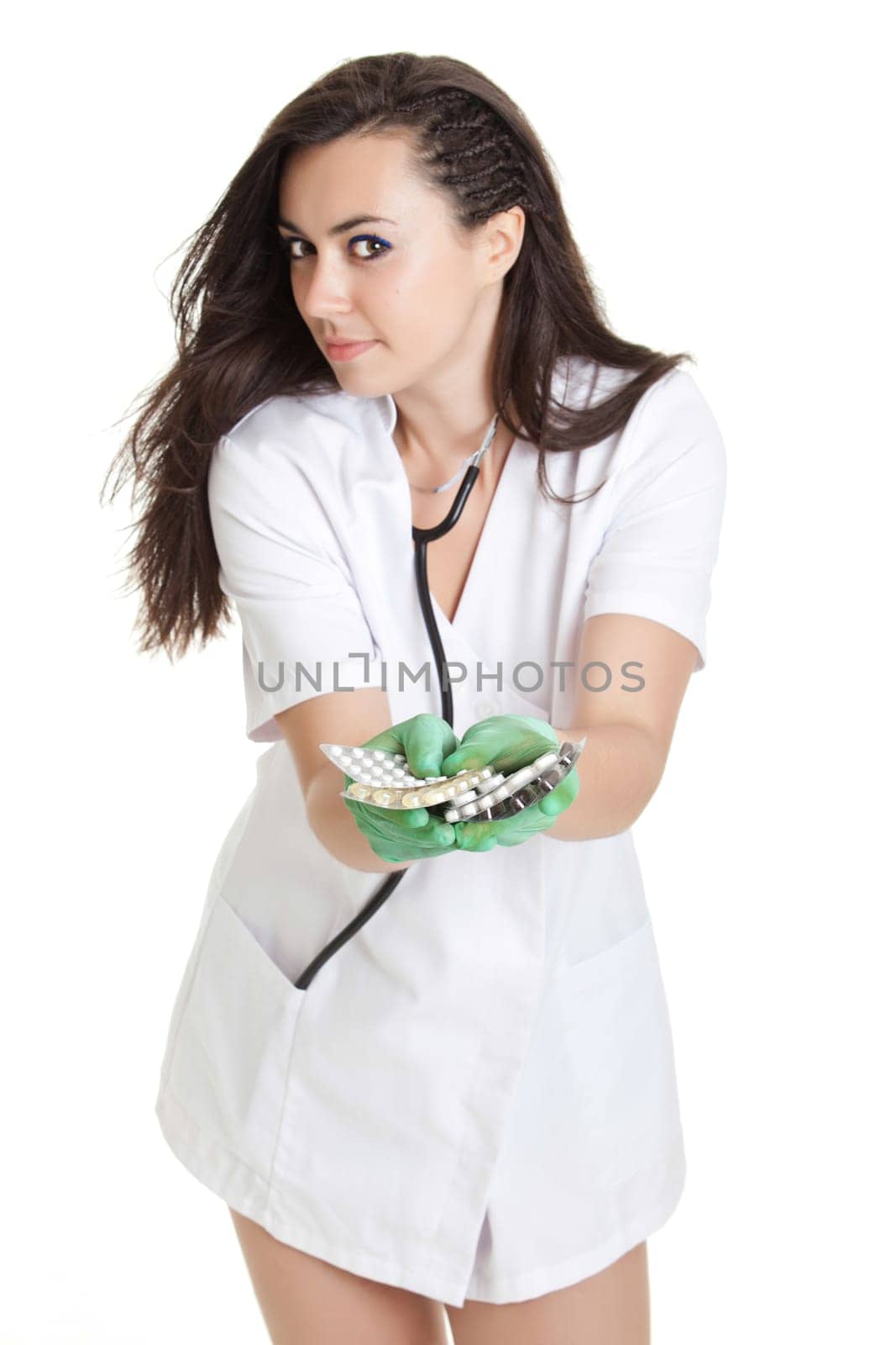 woman doctor with pills in hand. Female doctor holding many pills in her hands