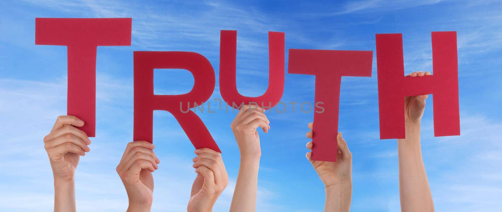 hands holding four pieces of a puzzle with copy space, gray background