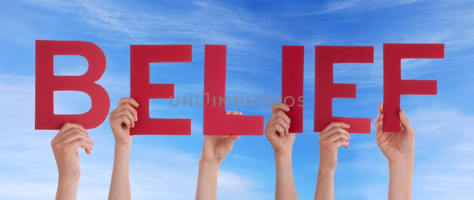 hands holding four pieces of a puzzle with copy space, gray background