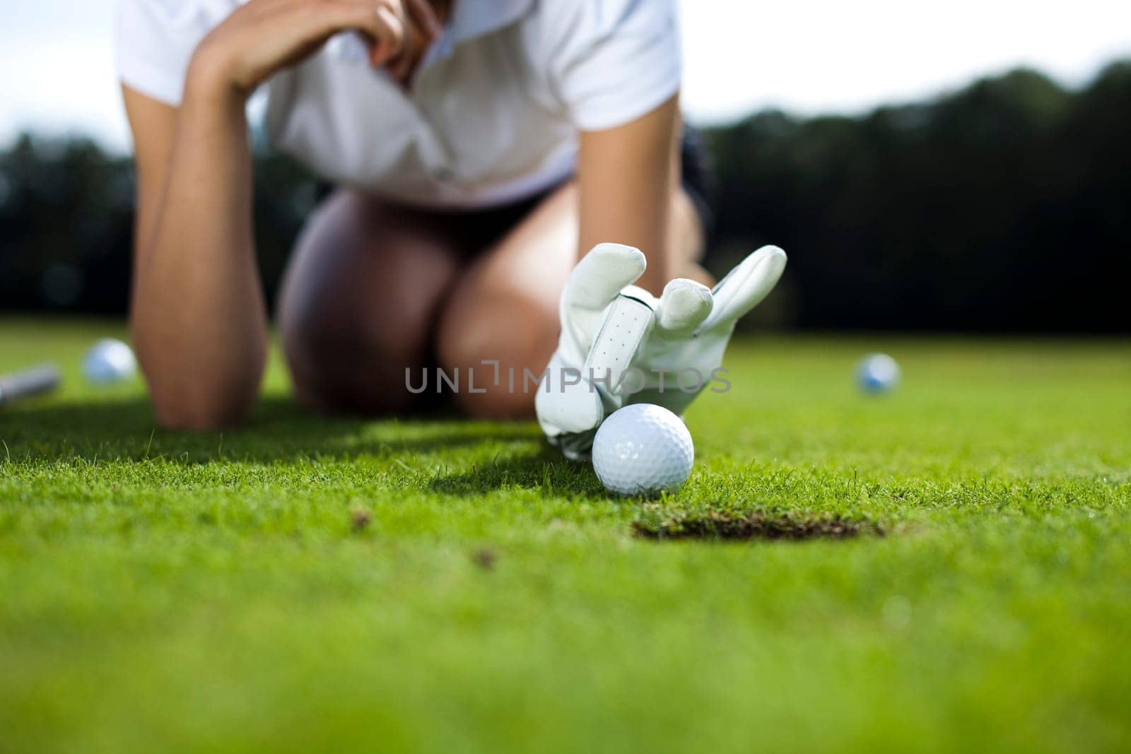 Playing golf, ball