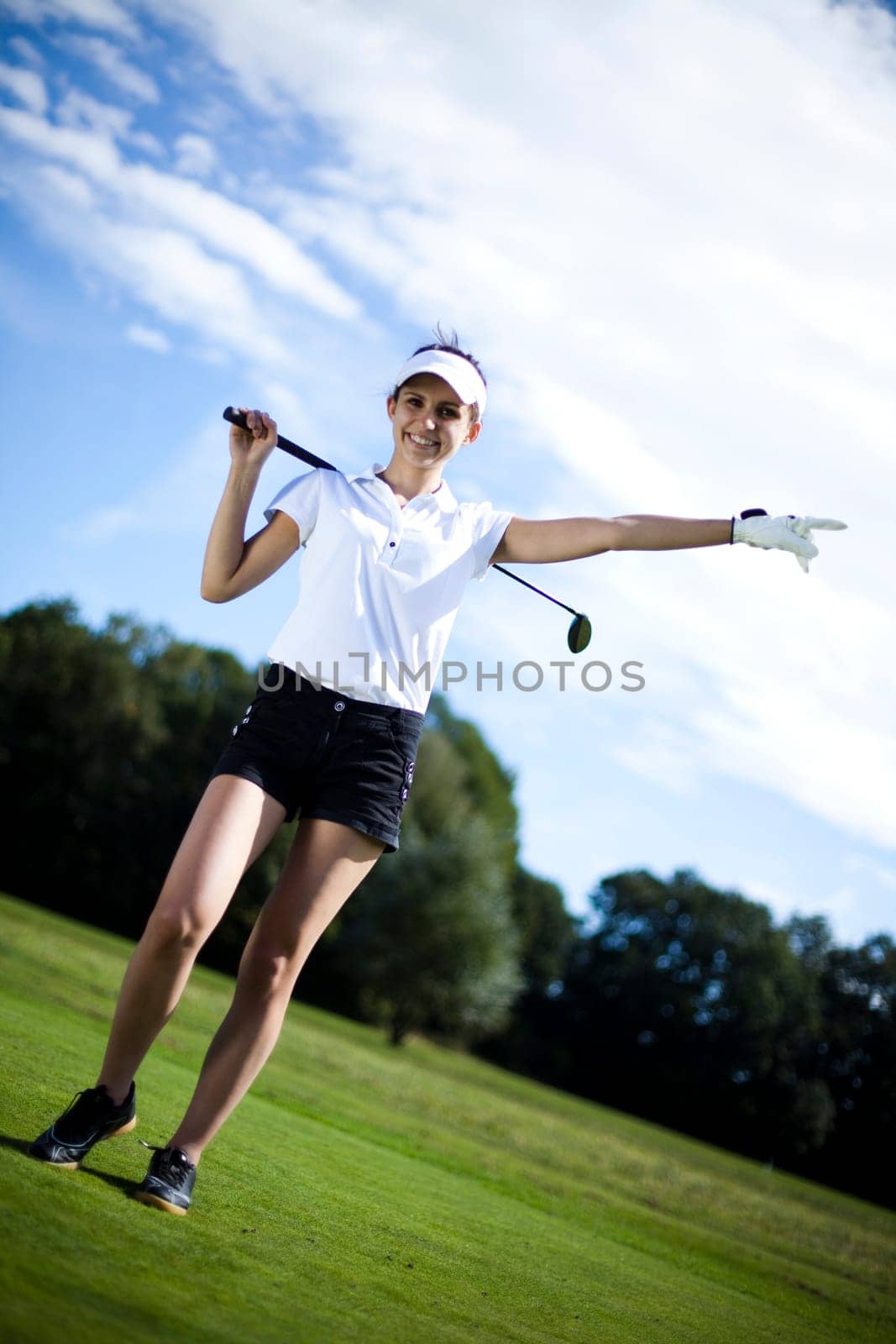 Young woman playing golf
