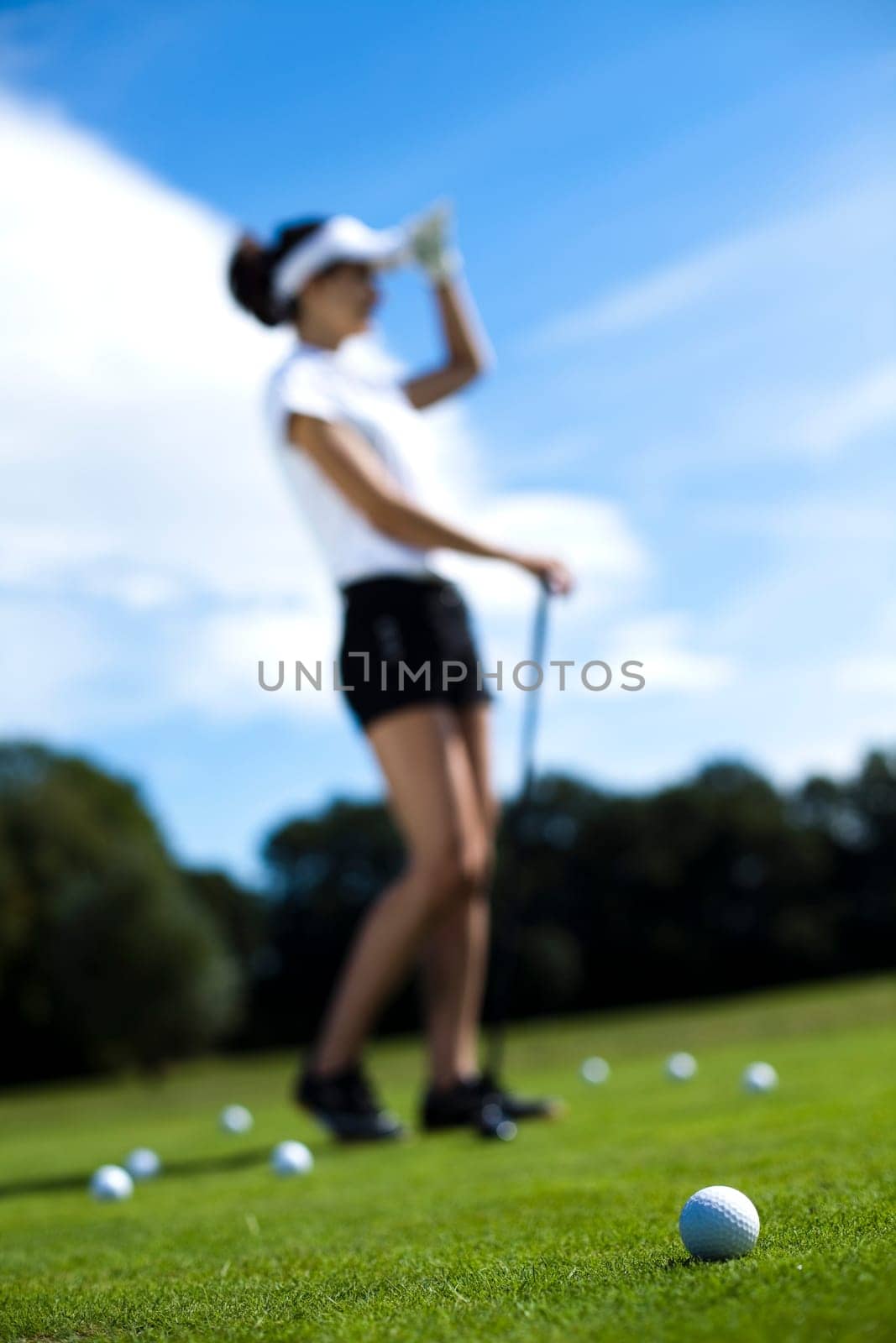 Girl playing golf