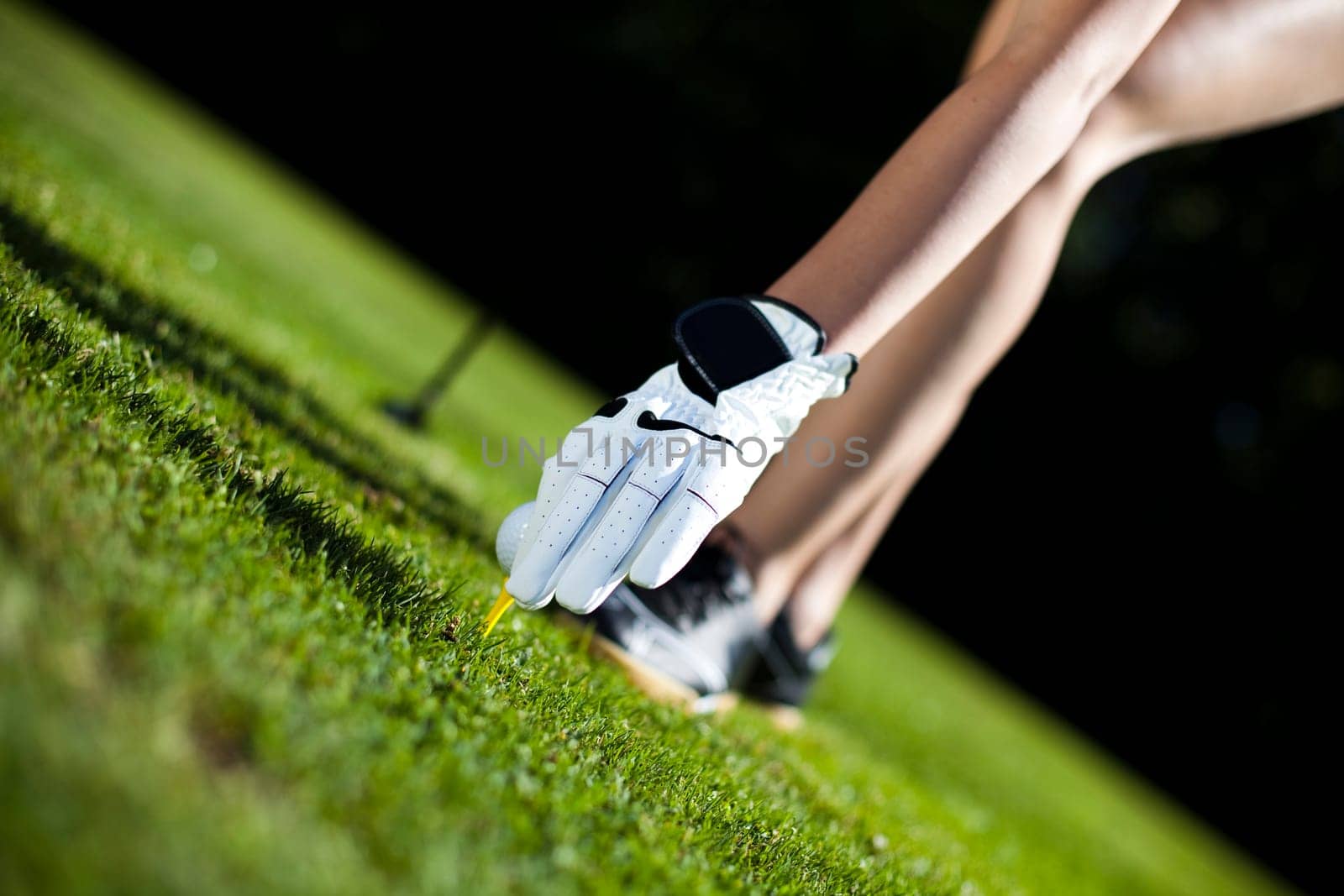 Playing golf, ball