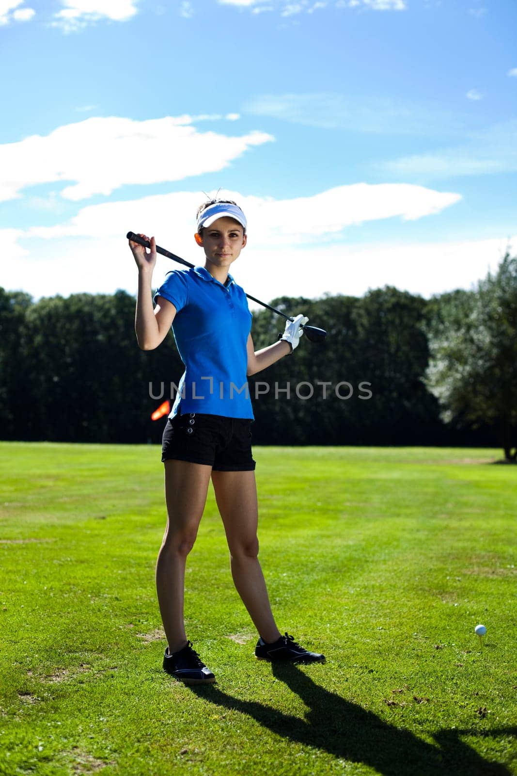 Girl playing golf