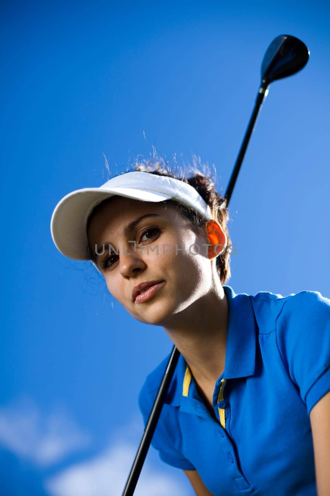 Young woman playing golf