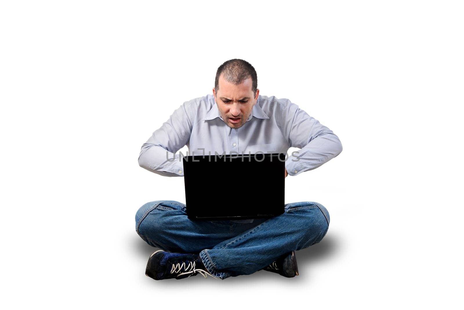stressed out businessman in front of laptop